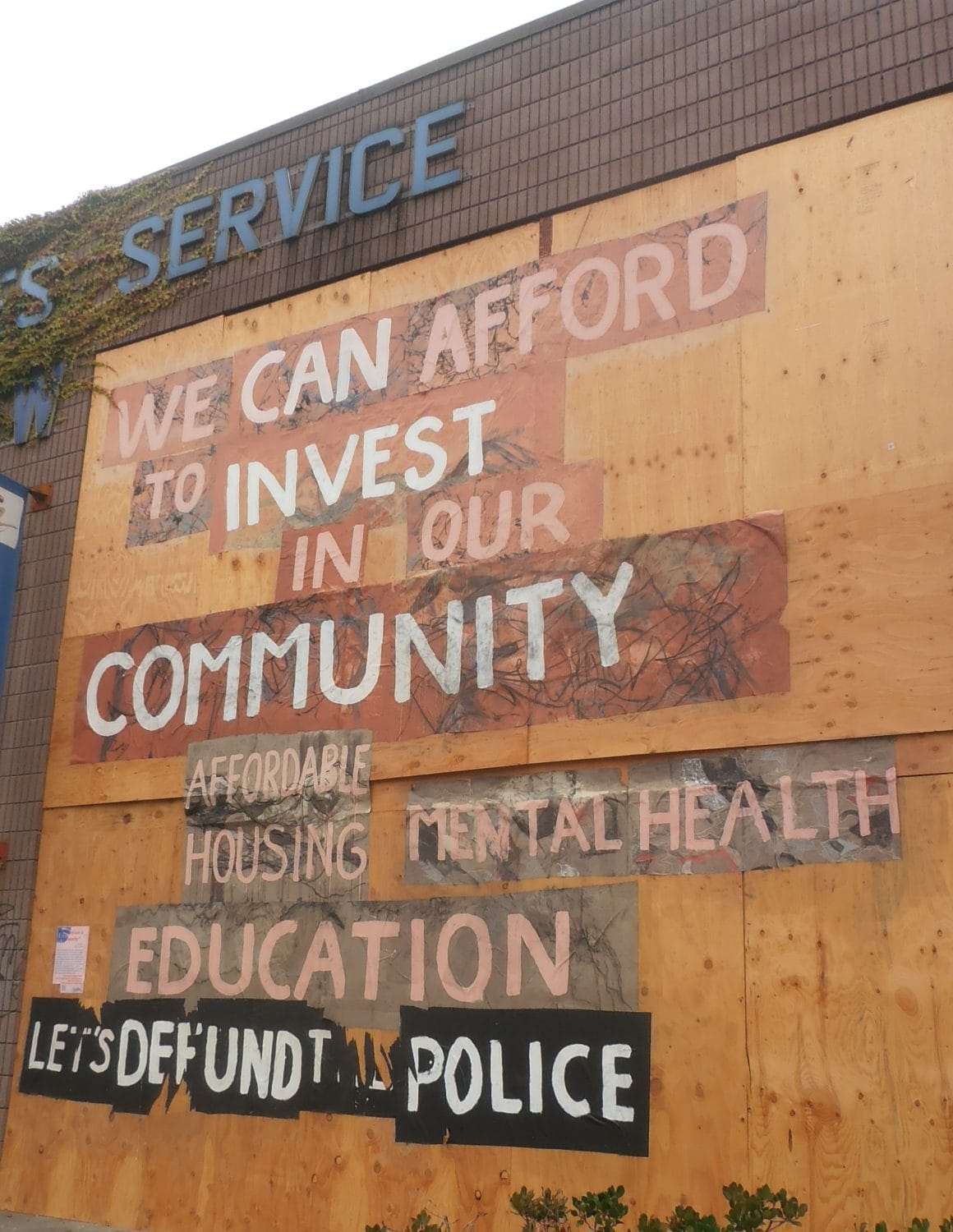 We-can-afford-to-invest-in-our-community-...-defund-the-police-message-on-boarded-up-window-Oakland-0820-by-Jahahara, Register, vote (y)our interests and continue organizing for power!, Culture Currents 