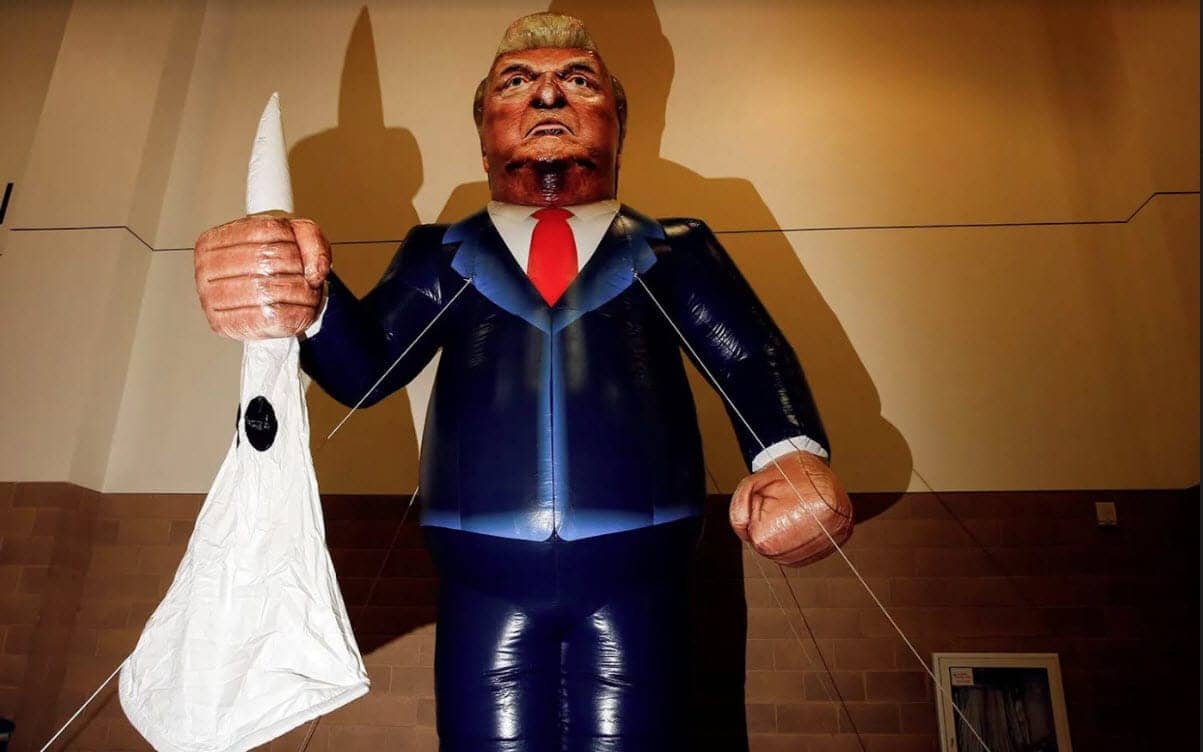 Inflatable-Donald-Trump-holds-KKK-mask, Low-key race war, News & Views 