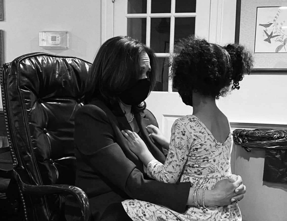 Kamala-Harris-in-office-chair-lil-Brown-girl-sitting-on-her-lap-cropped, Brown girl brown girl, Culture Currents 