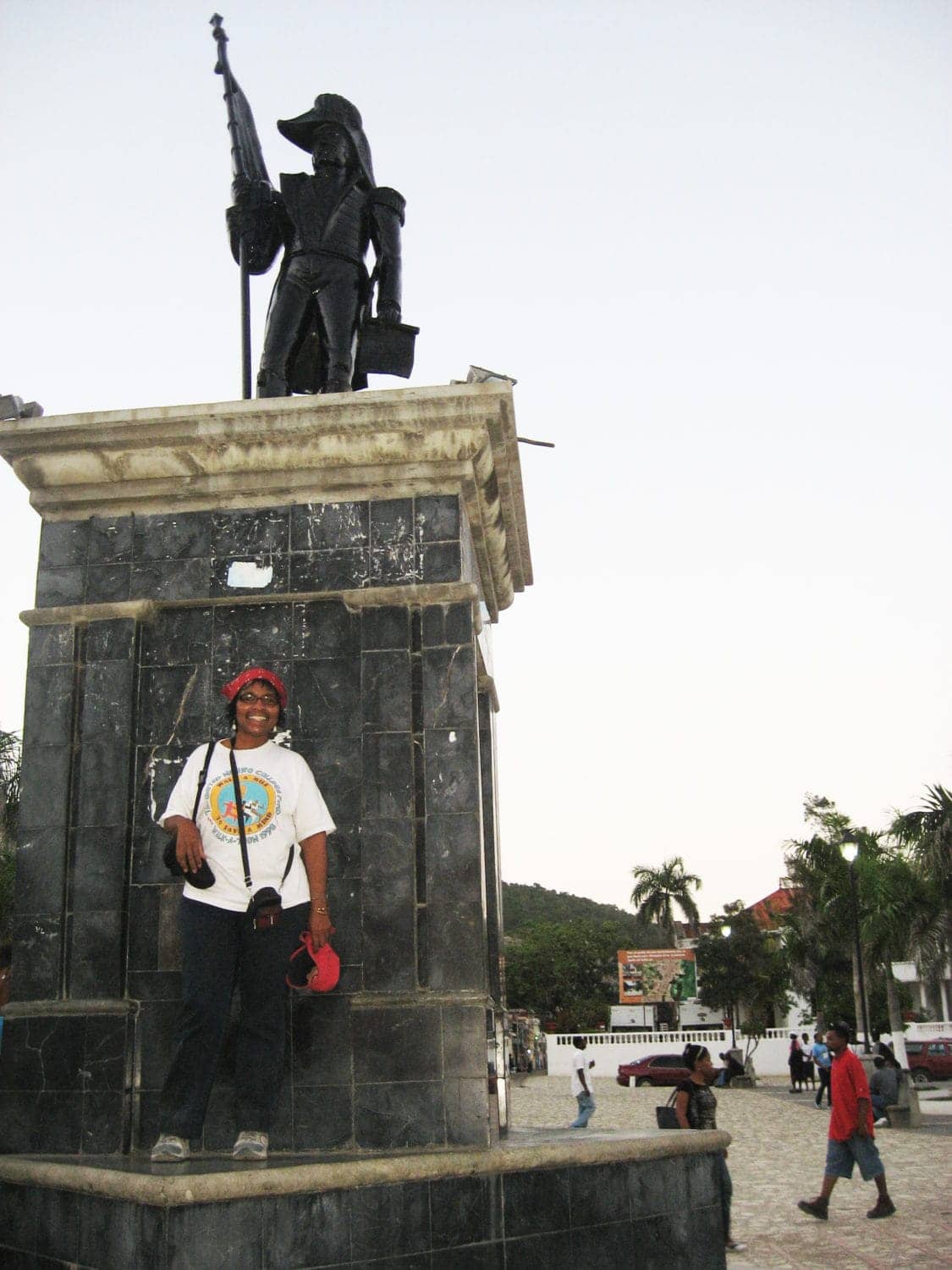 Wanda-stands-at-Haitian-Gen.-Henri-Christophe-statue-in-Cap-Haitian-where-he-led-Haitian-slaves-to-defeat-Napoleon, An epiphany – the largest slave insurrection in US history, Culture Currents 