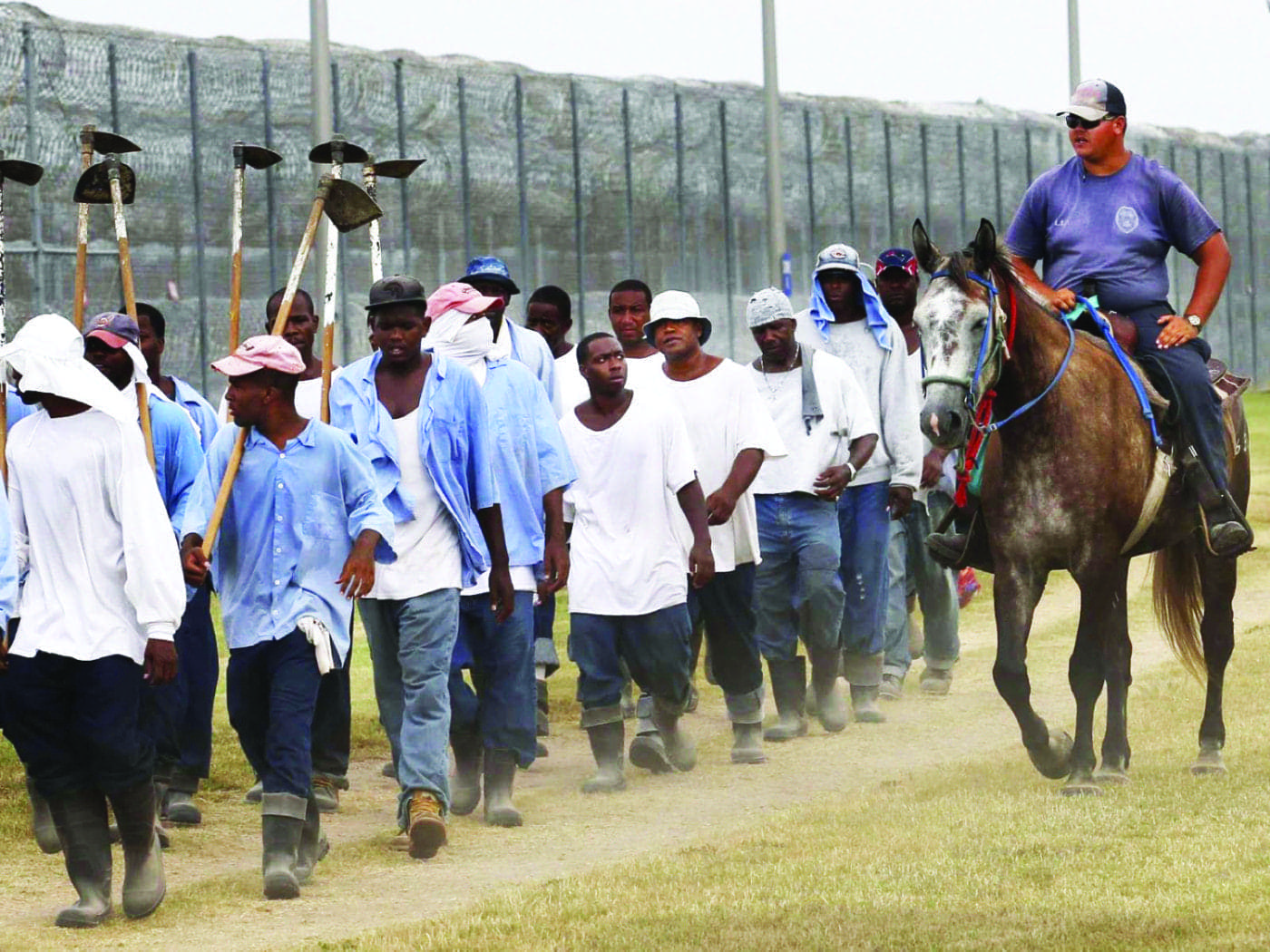 Angola-prisoners-marched-to-farm-work-1400x1050, Louisiana: The last slave state in America, Abolition Now! 