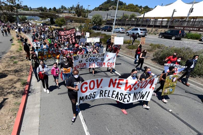Hundreds-march-on-Sir-Francis-Drake-Blvd-to-San-Quentin-Prison-demanding-better-COVID-protection-of-prisoners-080220-by-Jose-Carlos-Fajardo-Bay-Area-News-Group, San Quentin on trial for 29 COVID-19 deaths under its watch, Local News & Views 