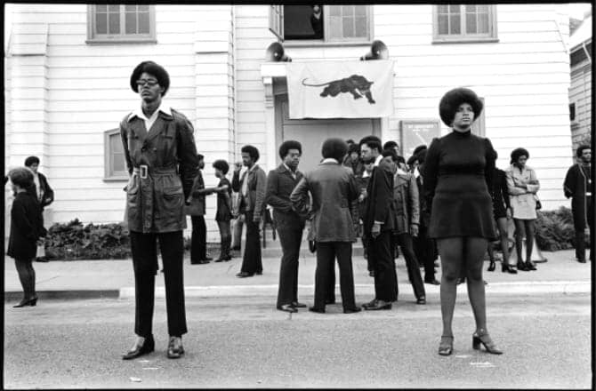 Glen-Wheeler-and-Claudia-Grayson-aka-Sister-Sheeba-outside-George-Jacksons-funeral-at-St.-Augustines-Church-in-Oakland-082871-cy-Zocalo-Poets, Wanda’s Picks for September 2021: An interview with Kumasi, Black August historian, Culture Currents 