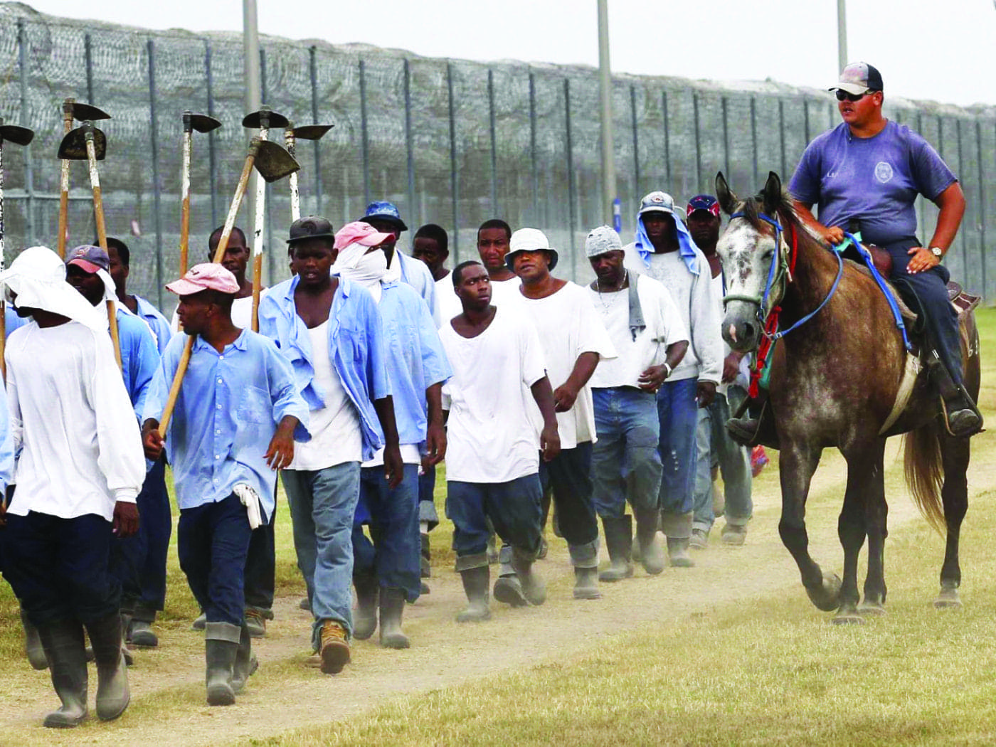 Angola-prisoners-hoe-squad-marched-back-after-day-of-farm-work-081811-by-Gerard-Herbert-AP-1400x1050, Imprisoned in ‘Sundown Towns’: The racial politics of my domestic exile, Abolition Now! 
