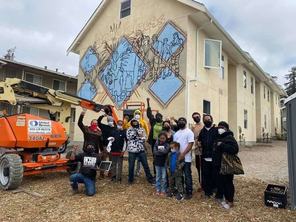 Deecolonize-Academy-teachers-families-and-students-in-front-of-Kiss-My-Black-Arts-community-mural-by-Tiny-Gray-Garcia-POOR-Magazine-2021, College in Covid: A nightmare of access for Poor, Black, Brown, Indigenous and Disabled students in the US, Culture Currents 