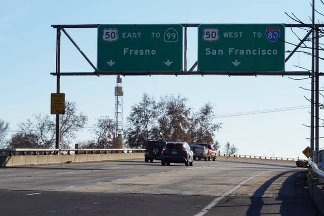 Fresno-to-San-Francisco-freeway-sign-for-the-50-99-and-I-5-by-Antonio-Ray-Harvey-CBM, Roads and Reparations: How highway construction hardened discrimination, News & Views 