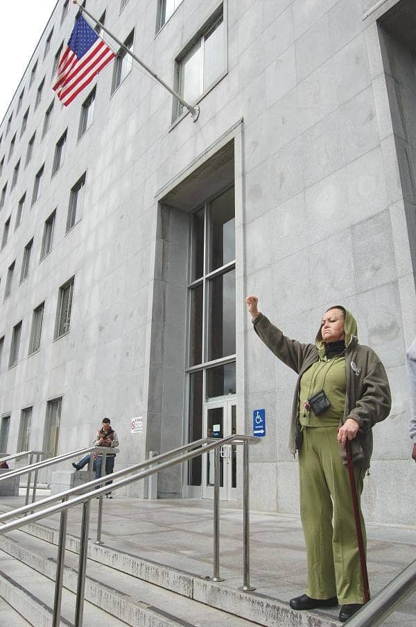 Mesha-Irizarry-raises-her-fist-alone-at-Hall-of-Justice, Against all odds, Mama Mesha Irizarry lives to fight another year, Featured News & Views 