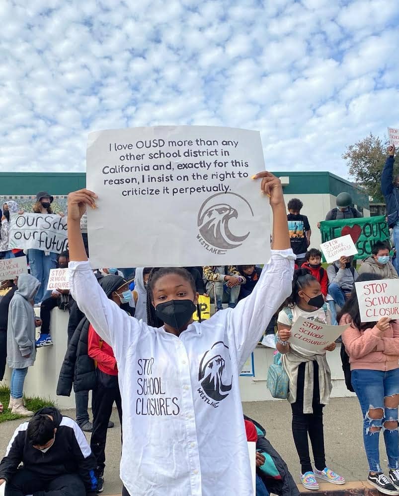 I-insist-on-the-right-to-criticize-OUSD-perpetually-student-holds-sign-at-student-protest-ag-school-closures-0222, Students, parents and community are hunger striking, protesting Oakland’s school closings in Black and Brown neighborhoods, News & Views 