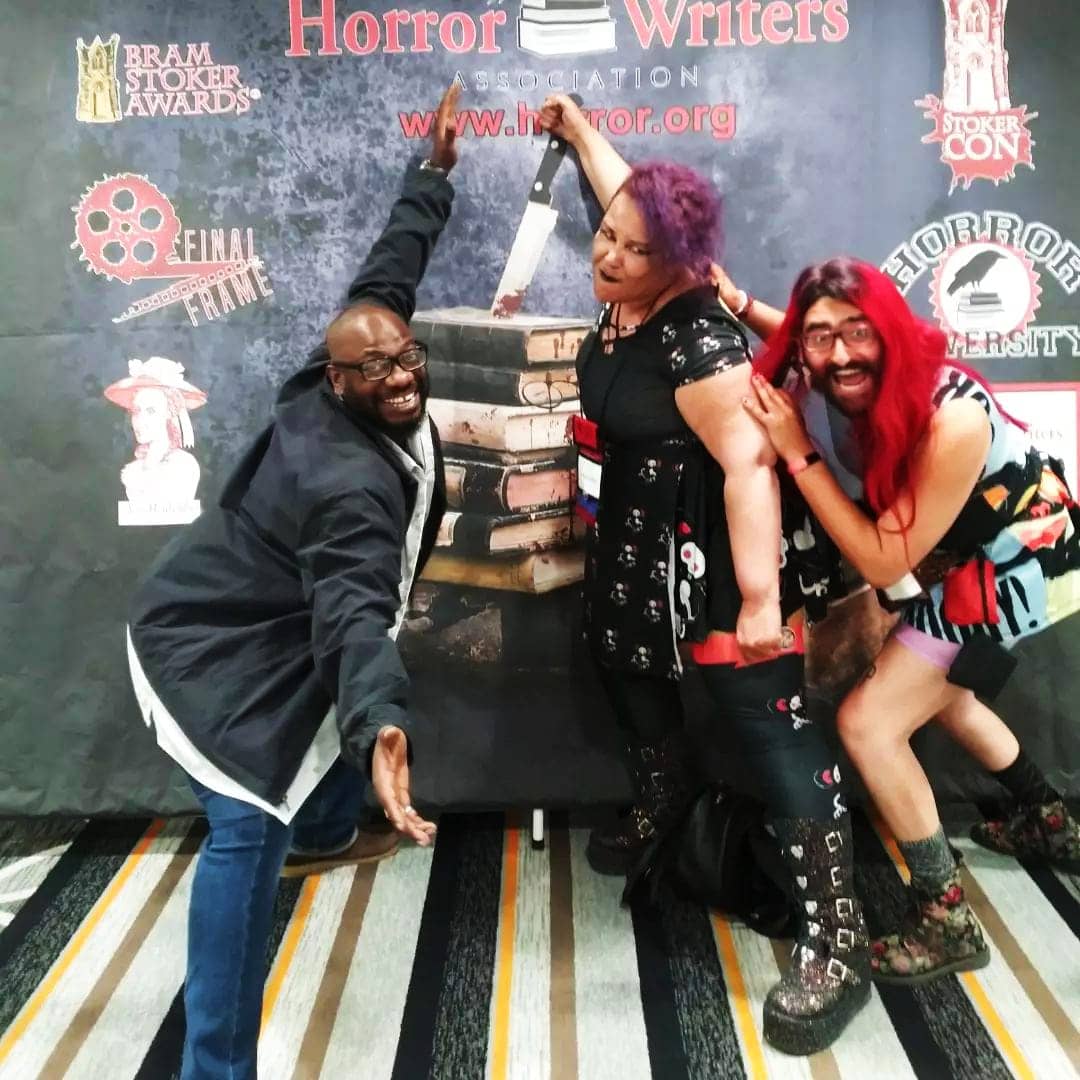 Kurt-Johnson-Sumiko-Saulson-and-Emily-Flummox-posing-front-of-the-HWA-banner-StokerCon-0522, StokerCon 2022 was like a Black family reunion, but the struggle is far from over, Culture Currents News & Views 