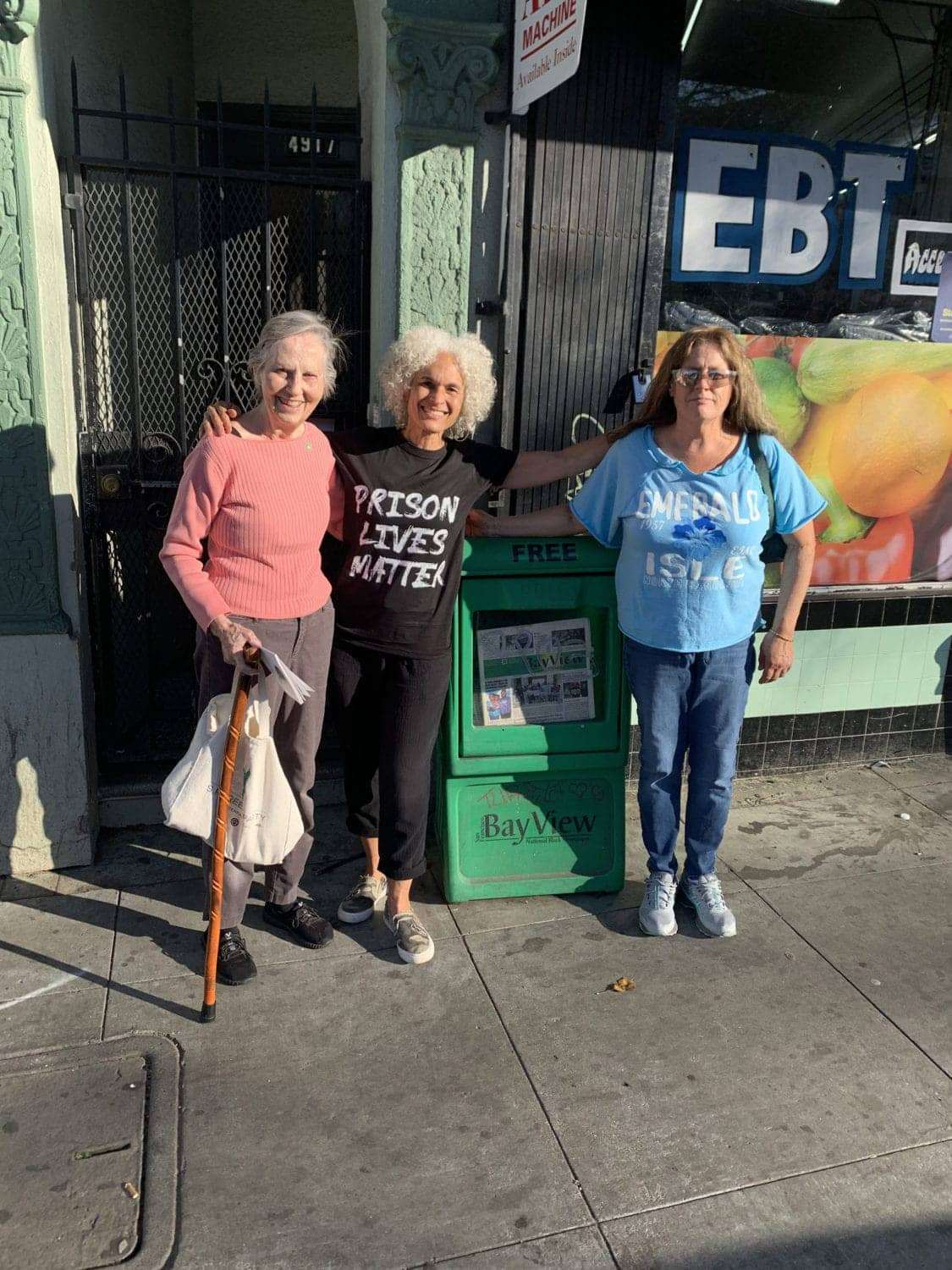 Kelly-with-Mary-Ratcliff-and-Nube-at-SF-Bay-View-office-and-paper-rack-22022, T.H.U.G L.I.F.E: From gangster to growth, Abolition Now! 