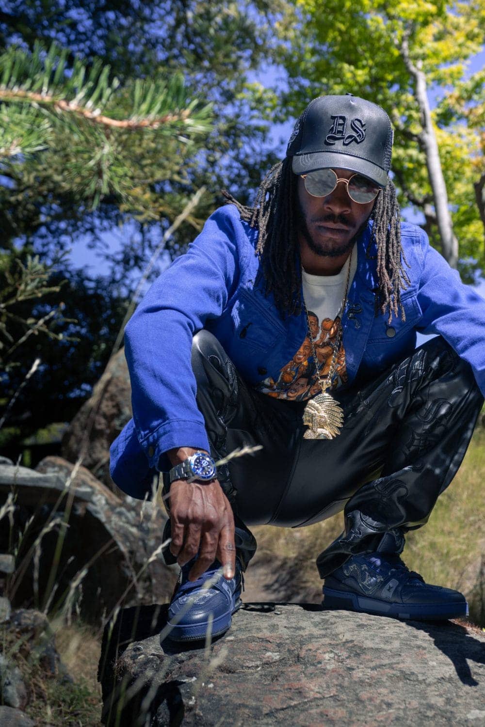 Jelane-Dugan-squatting, It’s time: Rapper Jelane Dugan releases new album and talks motivations and losses, Culture Currents Local News & Views News & Views 