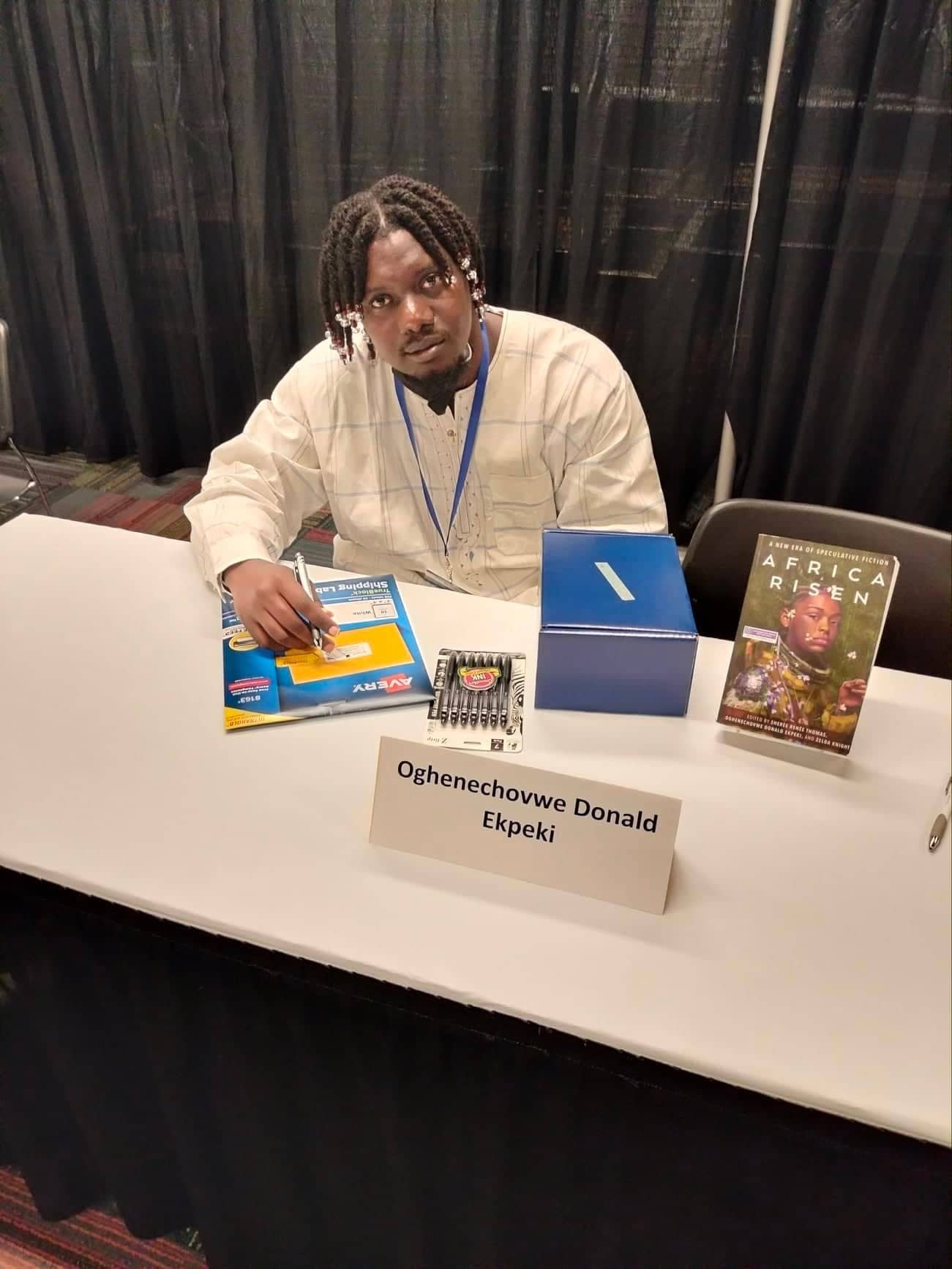 Oghenechovwe-Donald-Ekpeki-at-book-signing-at-WorldCon-0922, First African-born Black Nebula Award winner faces death threats & hostile embassy to attend WorldCon, Culture Currents Featured 