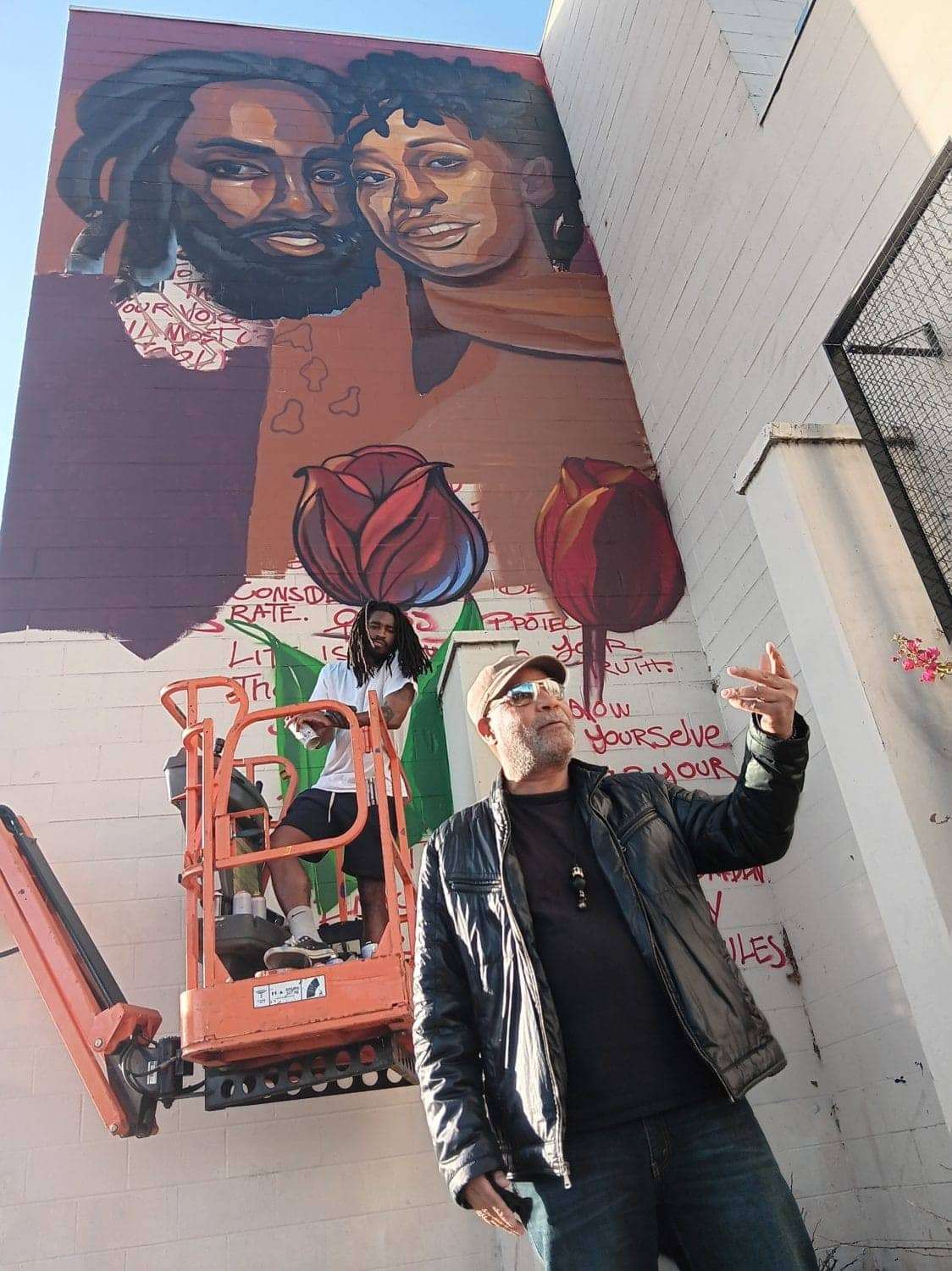 Minister-of-Culture-and-revolutionary-artist-Emory-Douglas-and-Oakland-Artist-Tim-B-in-front-of-the-Mumia-and-Wadiya-mural, Political prisoner and wife get mural in East Oakland, Culture Currents Featured Local News & Views News & Views 