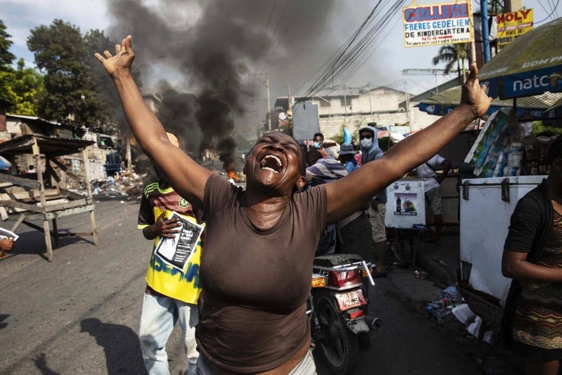 Haitian-woman-arms-outstretched-in-chaotic-protest-2023-1, In Haiti, 'gang warfare' is a cover for imperialist intervention, Abolition Now! News & Views World News & Views 