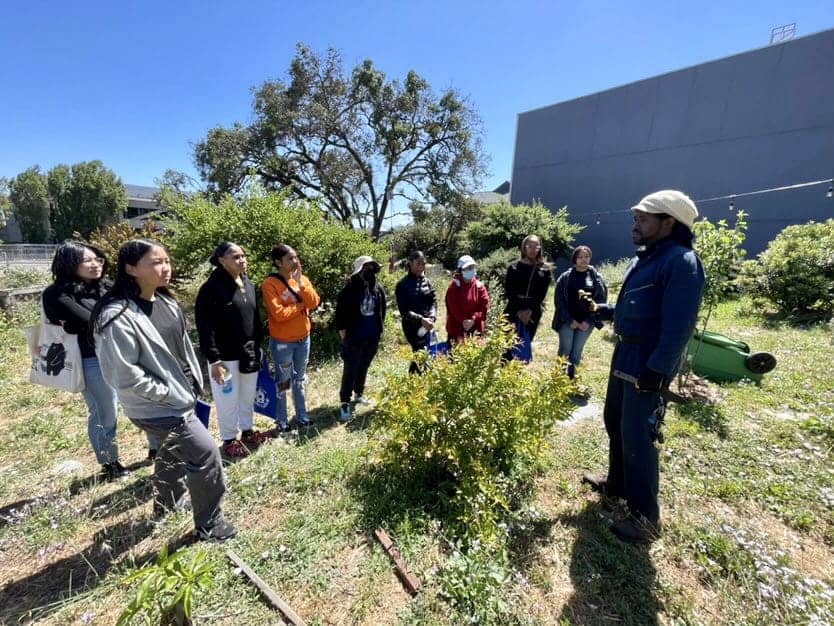 Isaiah-Powell-leads-a-teaching-tour-of-his-Palou-garden-0623, Bayview Hunters Point finally has its own farmers’ market – every Thursday, Featured Local News & Views 