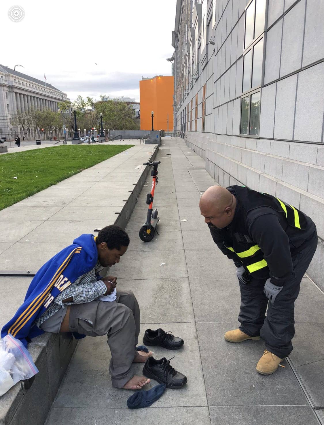 Urban-Alchemy-helps-an-unhoused-man-in-Civic-Center-Plaza, Urban Alchemy, a model for hope in San Francisco’s street team landscape , Featured World News & Views 