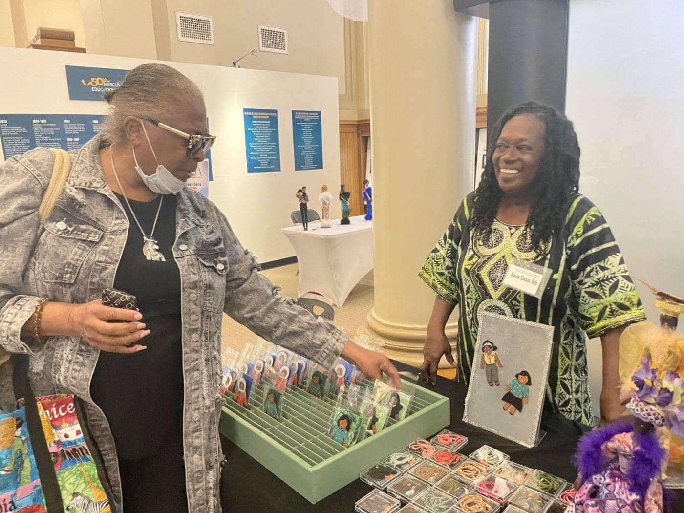 Black-Doll-Fest-Maxine-Grant-of-Alameda-buys-from-fest-founder-Karen-Oyekanmi-AAMLO-110423-by-Daphne-1400x1050, Black Doll Festival visits Oakland’s African American Museum, Culture Currents World News & Views 