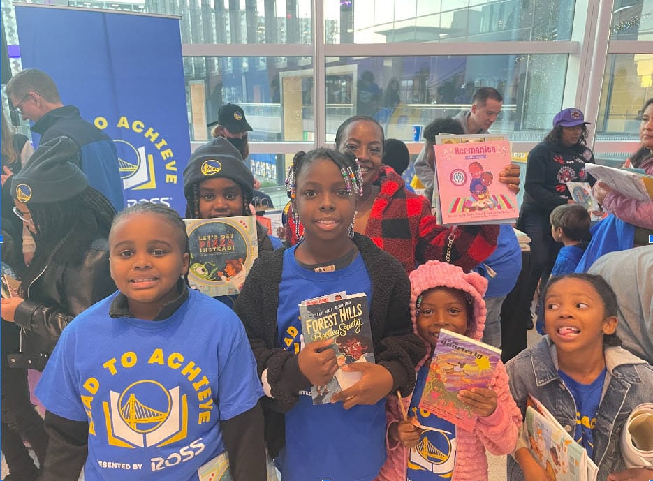 Children-get-books-at-Warriors-Read-to-Achieve-Night-by-Kia-Shaun-Walton, NBA champs champion literacy for Bay Area youth, Featured Local News & Views 