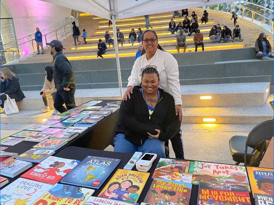 Marcus-Books-mother-daughter-duo-Cherysse-and-Akaysha-Calhoun-table-in-Warriors-Thrive-City-010724-by-Kia-Shaun-Walton, NBA champs champion literacy for Bay Area youth, Featured Local News & Views 