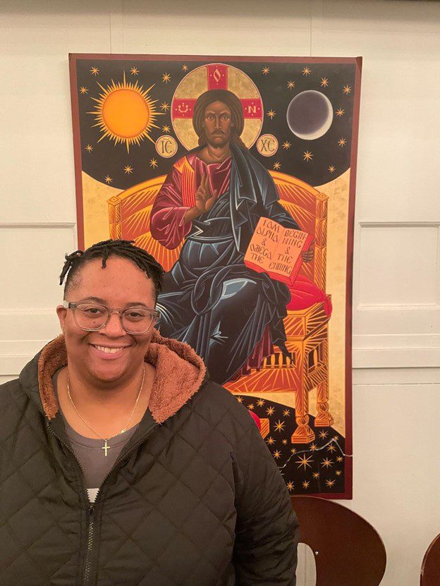 Ashley-Smiley-in-front-of-St.-John-Coltrane-African-Orthodox-Church-tapestry-for-her-a€˜Dirty-White-Teslas-Make-Me-Sada€™-Magic-Theater-by-Kia-Walton, World premiere of Ashley Smiley’s ‘Dirty White Teslas Make Me Sad’, World News & Views 