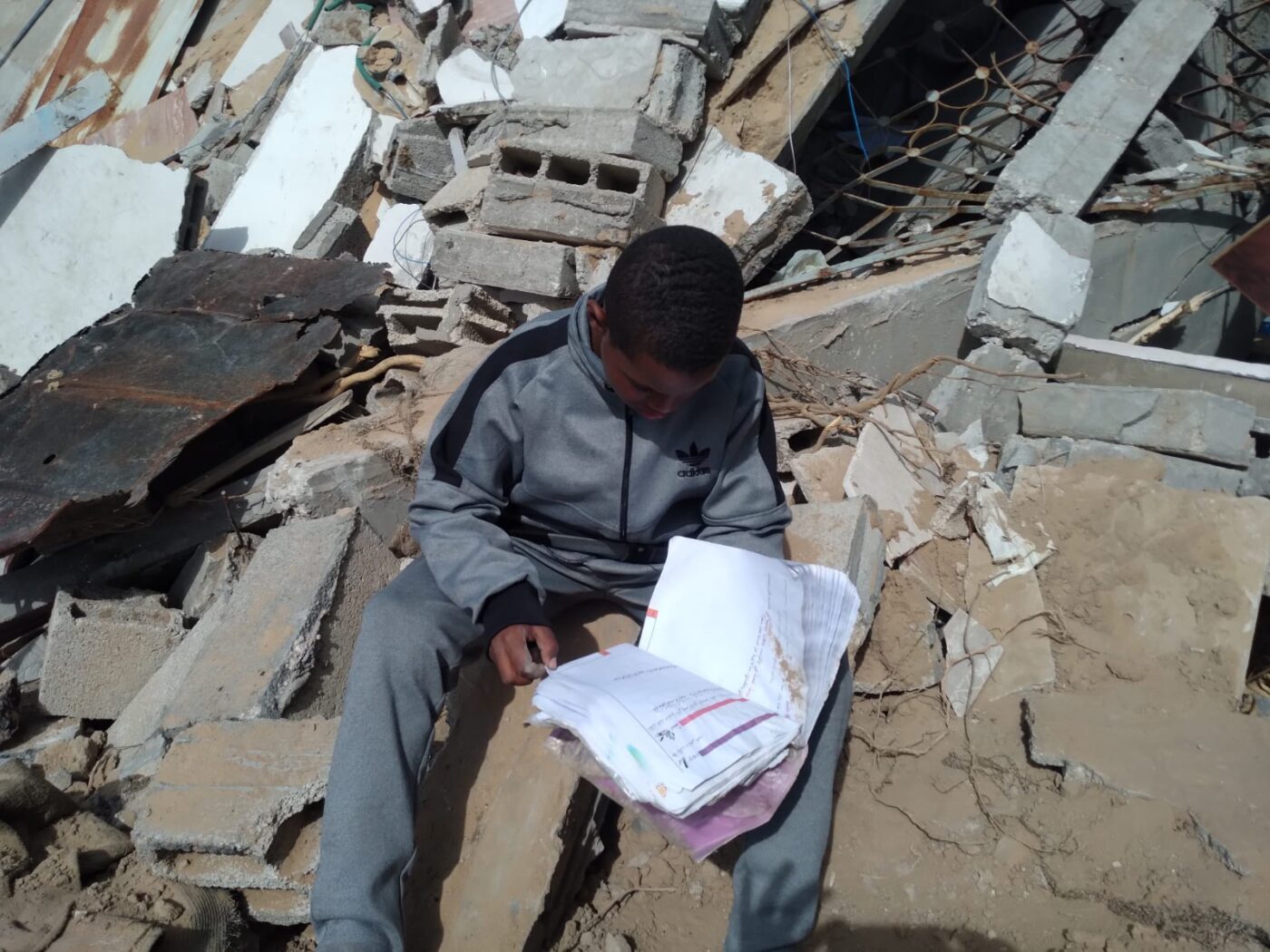 Black-child-reads-outside-Gaza-1400x1050, Comrade George, Gaza and the Black Community, Featured World News & Views 