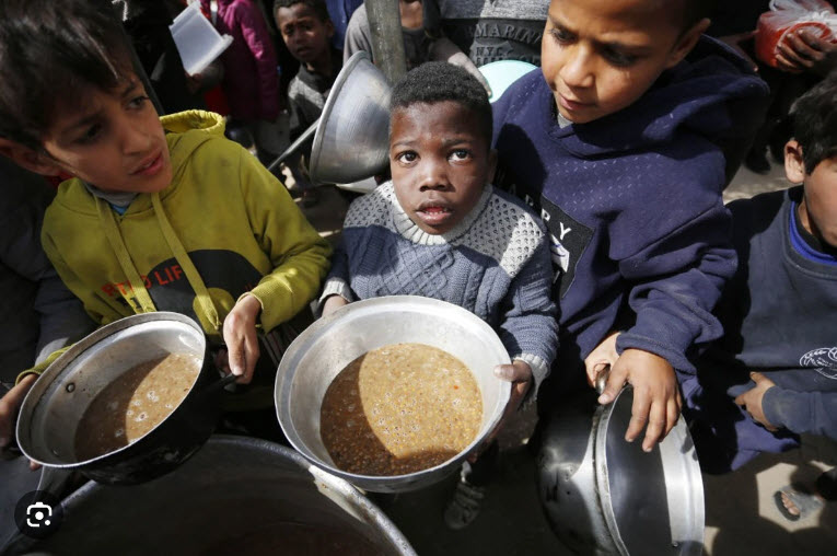 Starving-Palestinians-line-up-for-food-Gaza-030124-by-Ashraf-Amra-Anadolu, Israeli massacre of starving Palestinians prompts Biden to promise air-dropped food, Featured World News & Views 