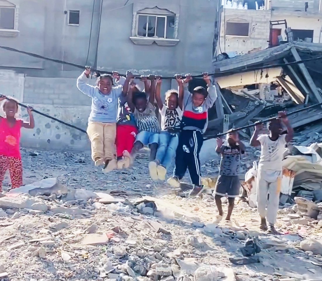 black-palestinian-children-rig-swing-in-rubble, ‘At the United Nations, the flag of human rights still flies at half-mast’ , World News & Views 