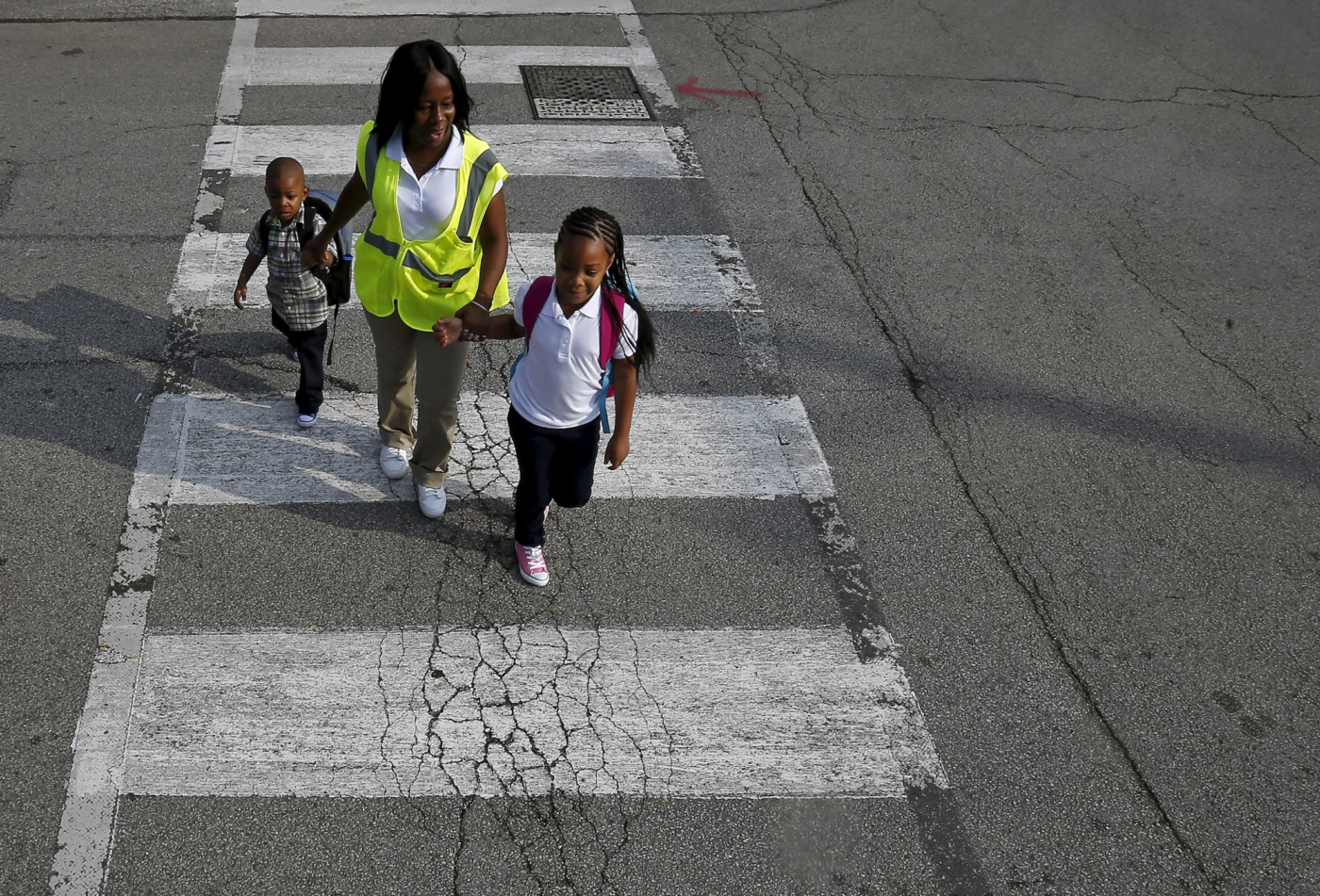 crossing-guard-helping-black-children-across-the-street-1400x951, Walking while Black: The inequitable intersection of racism at the intersection, World News & Views 