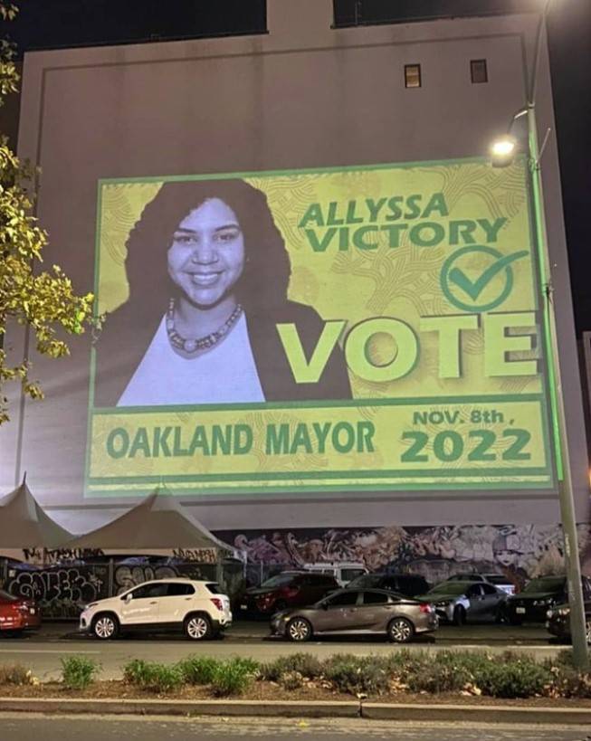 allyssa-victory-campaign-poster-projected-on-bldg-wall-1121, Potential Oakland mayoral candidate Allyssa Victory weighs in on local recalls and '24 election results, Featured Local News & Views 