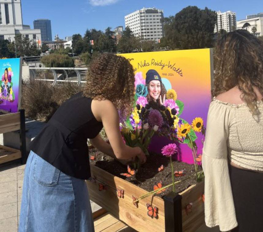 jada-imani-and-another-black-tulip-attendee-building-an-altar-in-honor-of-zoe-reidy-watts-at-the-lake-merritt-amphitheater-by-kristal-raheem, Black Tulip calls for action and a cultural shift in Oakland for Black women’s safety, Local News & Views 