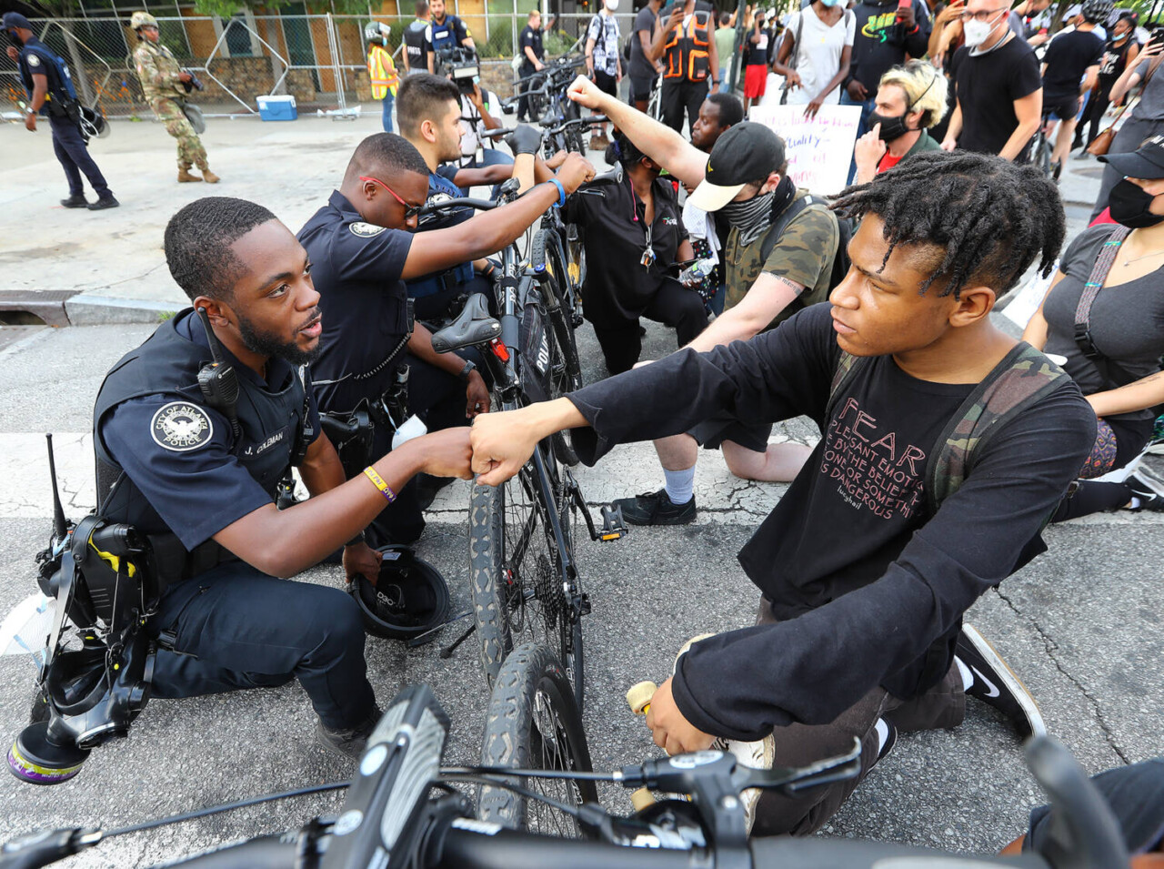 atlanta-cop-j.-coleman-protester-elijah-raffington-fist-bump-in-solidarity-060320-by-curtis-compton-aj-c-1, How Black police and soldiers have resisted federal takeovers, Local News & Views 