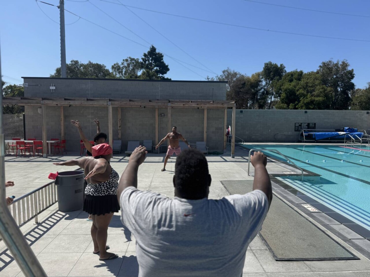 belle-haven-action-swim-workshop-participants-stretch-at-the-belle-haven-action-community-center-with-nubian-sharks-founder-and-instructor-prince-dean, Nubian Sharks founder and instructor Prince Dean teaches a swim workshop with Belle Haven Action, News & Views 