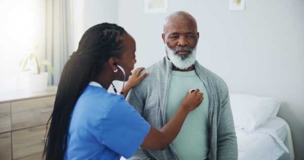 black-woman-doctor-examines-black-elder-patient, As millions face threats to their health insurance coverage, experts offer practical advice , World News & Views black-woman-doctor-examines-black-elder-patient, As millions face threats to their health insurance coverage, experts offer practical advice , World News & Views
