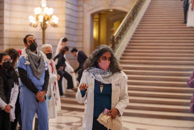 dr-rupa-marya-coordinates-vigil-in-sf-city-hall-honoring-gazas-healthcare-workers-killed-by-israel-by-john-avalos, UCSF fired me for speaking out against genocide, but as a physician I could not remain silent, Local News & Views dr-rupa-marya-coordinates-vigil-in-sf-city-hall-honoring-gazas-healthcare-workers-killed-by-israel-by-john-avalos, UCSF fired me for speaking out against genocide, but as a physician I could not remain silent, Local News & Views
