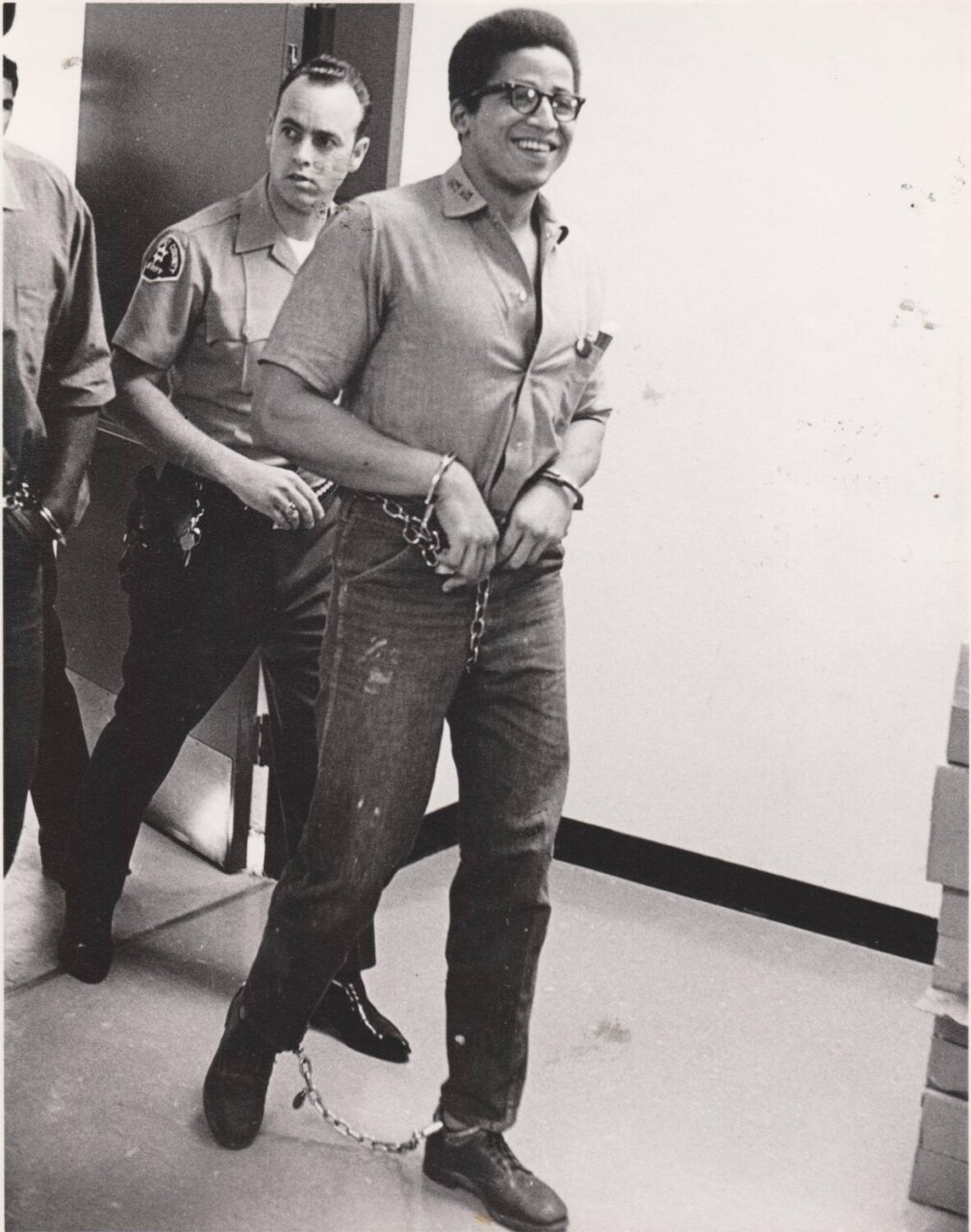 george-jackson-smiles-as-hes-escorted-by-guards, George Jackson’s funeral – August 1971, Local News & Views 