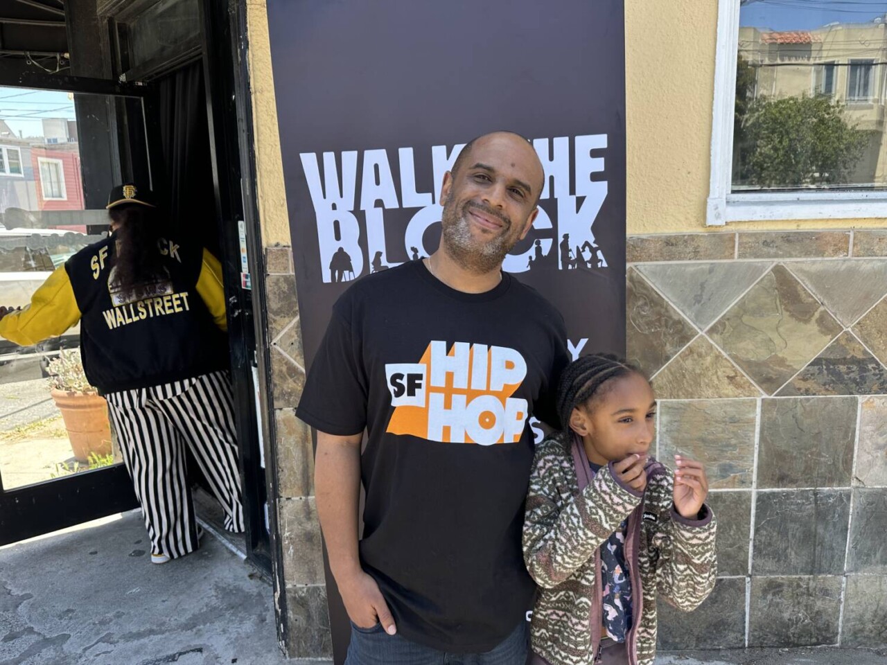 kamel-bell-co-founder-of-walk-the-block-with-niece-053025-by-kevin-epps, Walk the Block: Bayview Edition brings community, culture and celebration to Third Street, Event kamel-bell-co-founder-of-walk-the-block-with-niece-053025-by-kevin-epps, Walk the Block: Bayview Edition brings community, culture and celebration to Third Street, Event