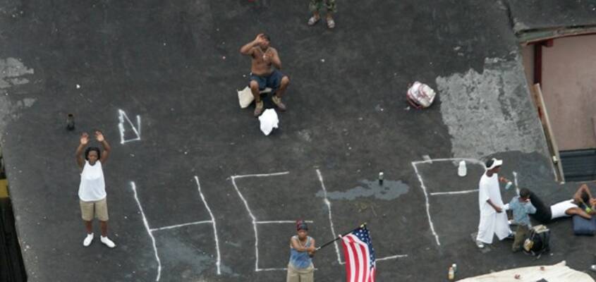 new-orleanians-wait-on-rooftop-for-rescue-from-katrina-floodwaters-by-david-j.-phillip-ap, This is criminal: How Katrina was used to drive Blacks from New Orleans, Local News & Views 