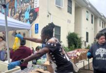 Theft of our last crumb. The federal government’s attempt to starve us and the emergency need for our own self-determined solutions Woman arranging and organizing goods on a table.