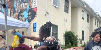 Woman arranging and organizing goods on a table.