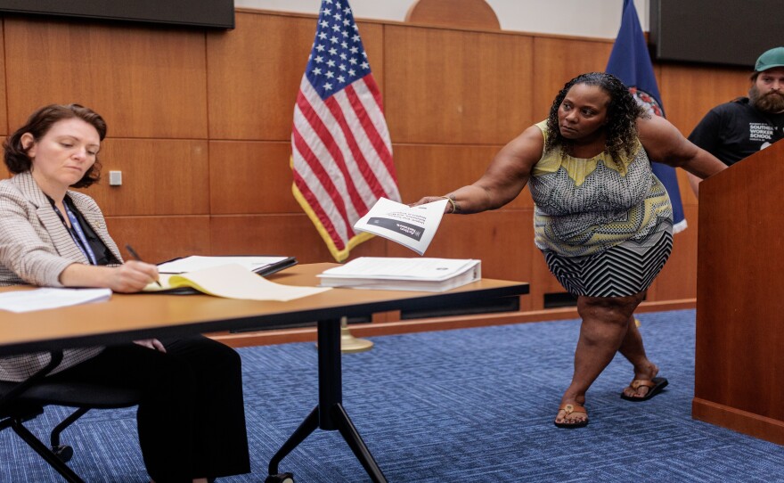 virginia-corrections-ombudsman-andrea-sapone-gazes-at-her-notes-as-an-uproar-member-giving-testimony-tries-to-get-her-attention, UPROAR calls out Virginia ombudsman at public meetings, Local News & Views 