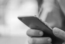 Reach inside and touch someone: Answering official lies about cell phones in prisons Cell Phone in a person's hands.