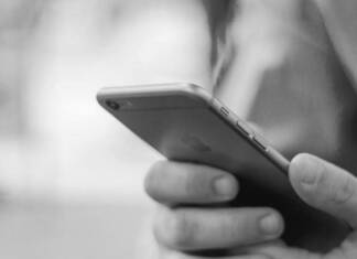 Reach inside and touch someone: Answering official lies about cell phones in prisons Cell Phone in a person's hands.