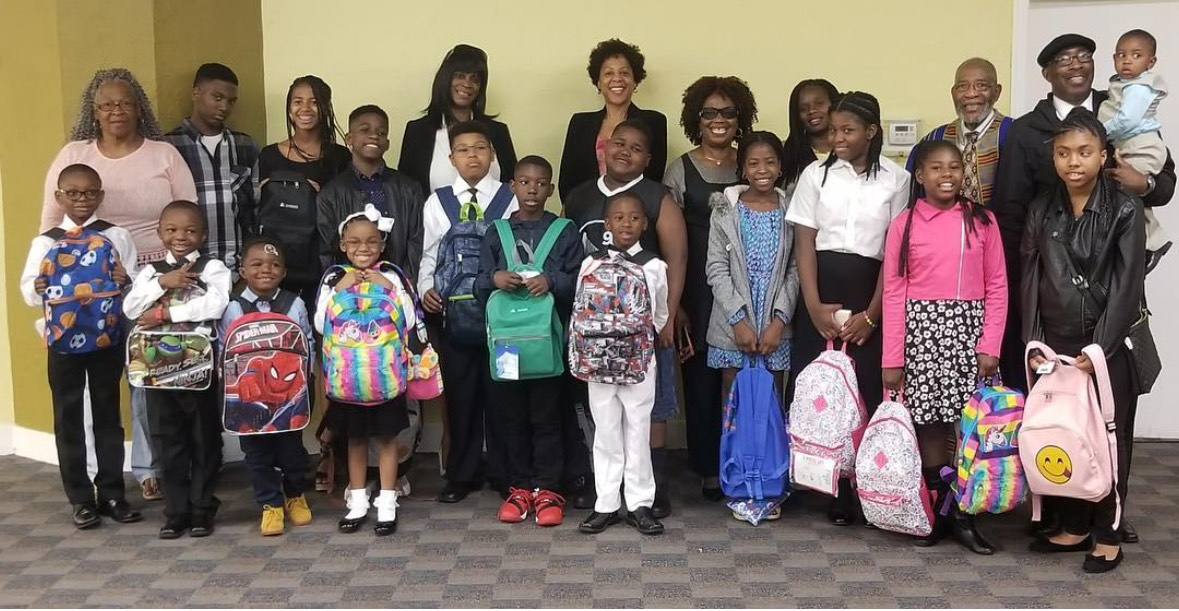 dr.-rev.-amos-c.-brown-top-row-second-from-right-with-teachers-and-educators-at-third-baptist-churchs-free-back-on-track-and-freedom-school-programs.-photo-courtesy-of-third-baptist-church-sf, $5 Million Reparations Fund: From Slavery’s Shadows, SF Mayor Signs Historic Measure for Black San Franciscans, Featured 