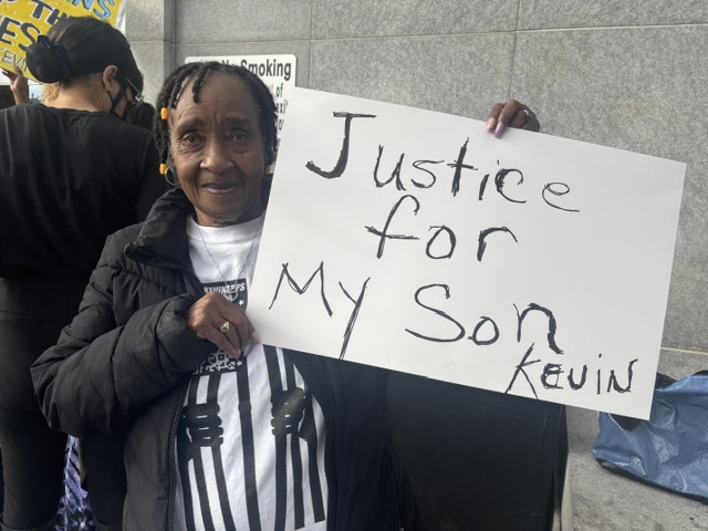 kevin-epps-mother-holds-rally-sign-, Stand with Kevin Epps: A Black historian on trial for murder, Featured Local News & Views 