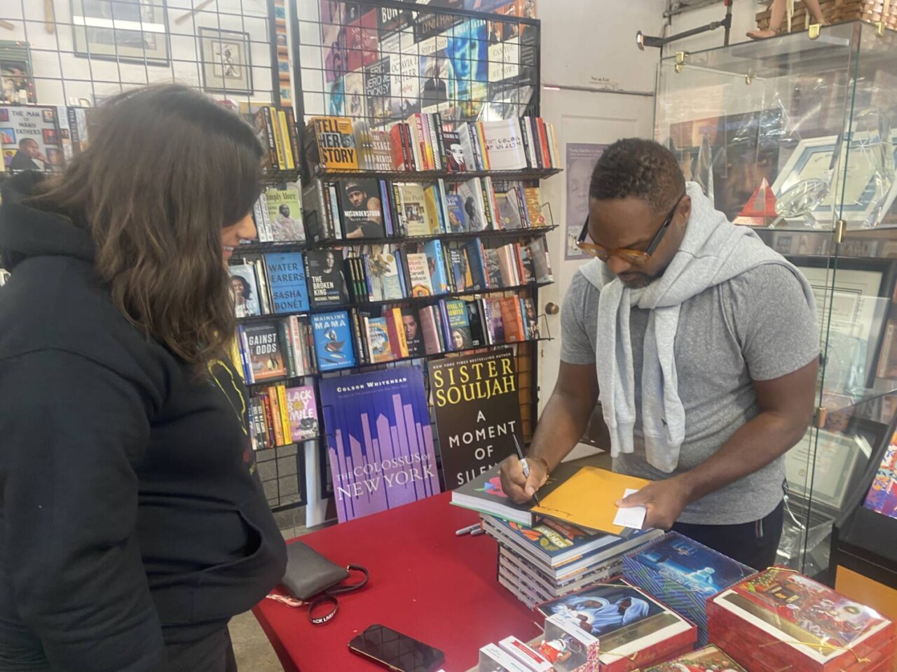 bryant-terry-signs-one-of-his-books-for-a-customer-at-marcus-books.-photo-by-dr.-tiffany-caesar-, Bryant Terry uplifts plant-based food and Black History at Marcus Books, Culture Currents bryant-terry-signs-one-of-his-books-for-a-customer-at-marcus-books.-photo-by-dr.-tiffany-caesar-, Bryant Terry uplifts plant-based food and Black History at Marcus Books, Culture Currents