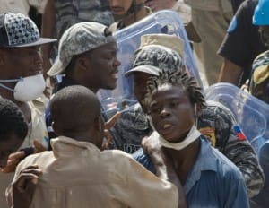 haiti-school-collapse-relative-vs-police-2-110908-by-ramon-espinosa-ap-300x232, Haitian families furious over school collapse, World News & Views 